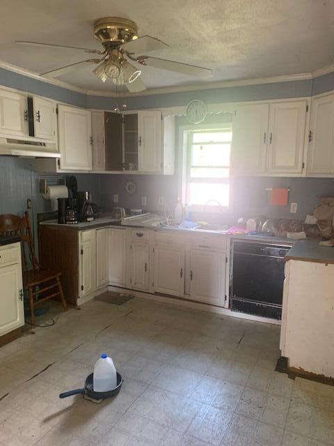 kitchen with white cabinets, light tile patterned floors, crown molding, dishwasher, and ceiling fan