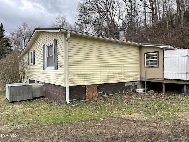 view of side of property with cooling unit