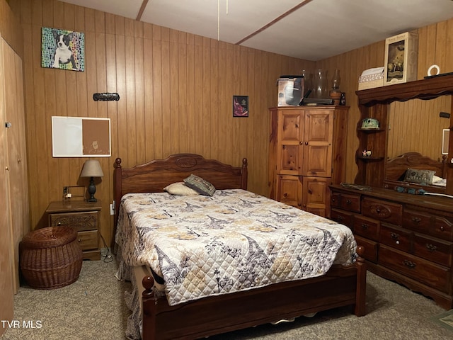 carpeted bedroom featuring wooden walls