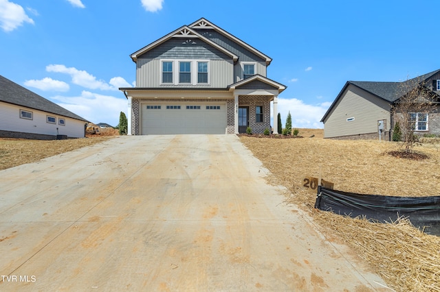 craftsman inspired home with board and batten siding, brick siding, driveway, and a garage