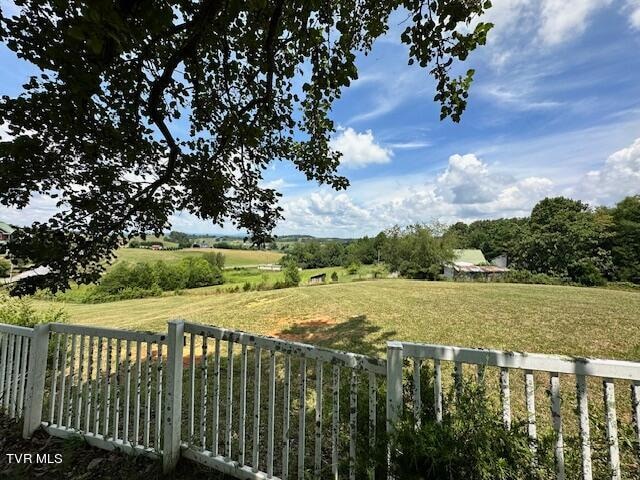 view of yard with a rural view