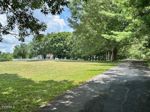 surrounding community featuring a lawn