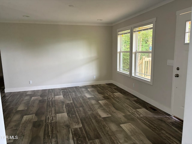 spare room with dark hardwood / wood-style flooring