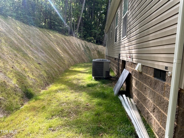 view of yard with central AC