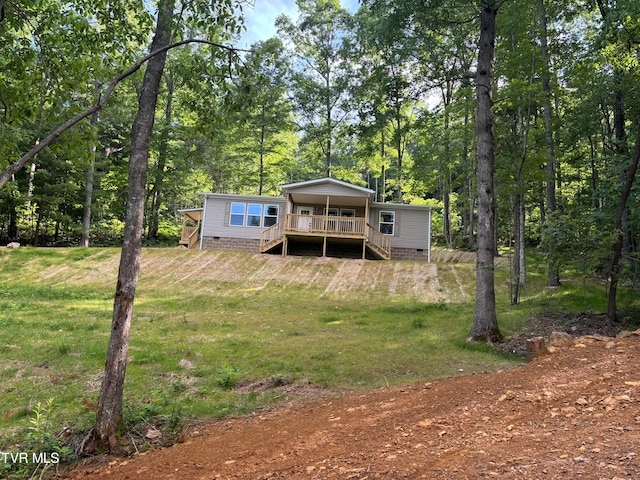 view of yard featuring a wooden deck