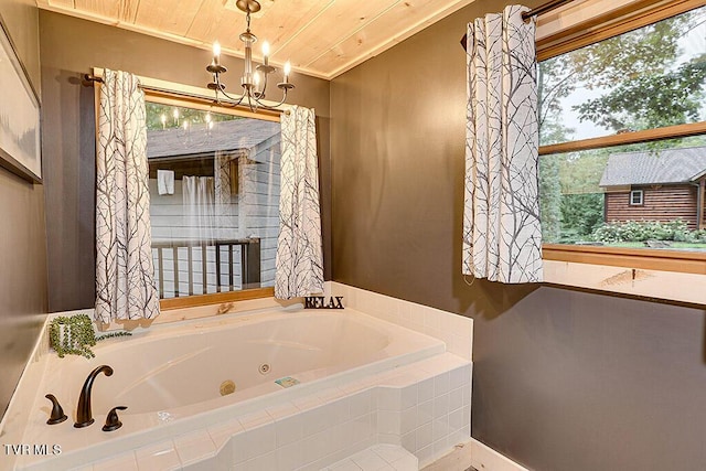 bathroom featuring a relaxing tiled tub, wood ceiling, and an inviting chandelier