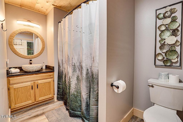 bathroom featuring crown molding, wood-type flooring, toilet, vanity, and wood ceiling