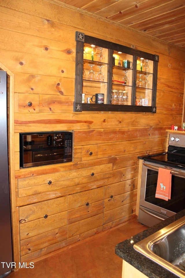 2044 Pigeon Creek Rd, Greeneville, TN 37743 - kitchen featuring wood ceiling, wooden walls, a sink, and stainless steel range with electric cooktop