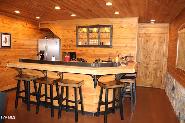 2044 Pigeon Creek Rd, Greeneville, TN 37743 - bar featuring stainless steel refrigerator with ice dispenser, recessed lighting, wood ceiling, wooden walls, and a bar