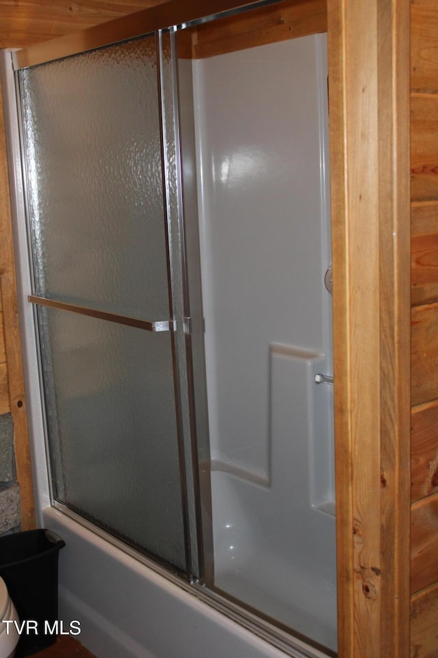 2044 Pigeon Creek Rd, Greeneville, TN 37743 - full bath with bath / shower combo with glass door, toilet, and wooden walls