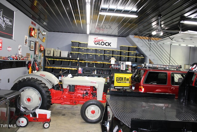 2044 Pigeon Creek Rd, Greeneville, TN 37743 - garage with a workshop area and a garage door opener