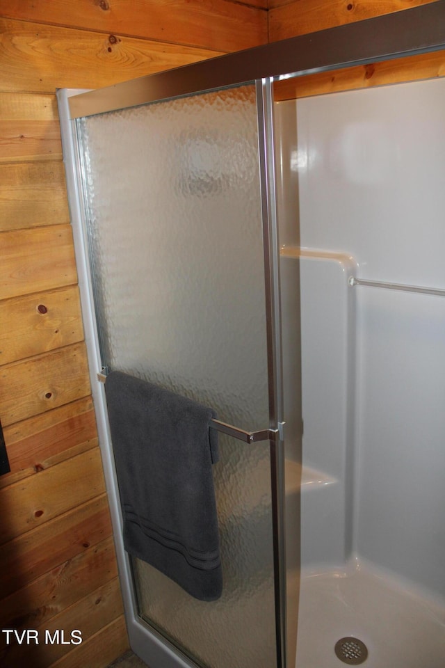 2044 Pigeon Creek Rd, Greeneville, TN 37743 - bathroom featuring wooden walls and a shower stall