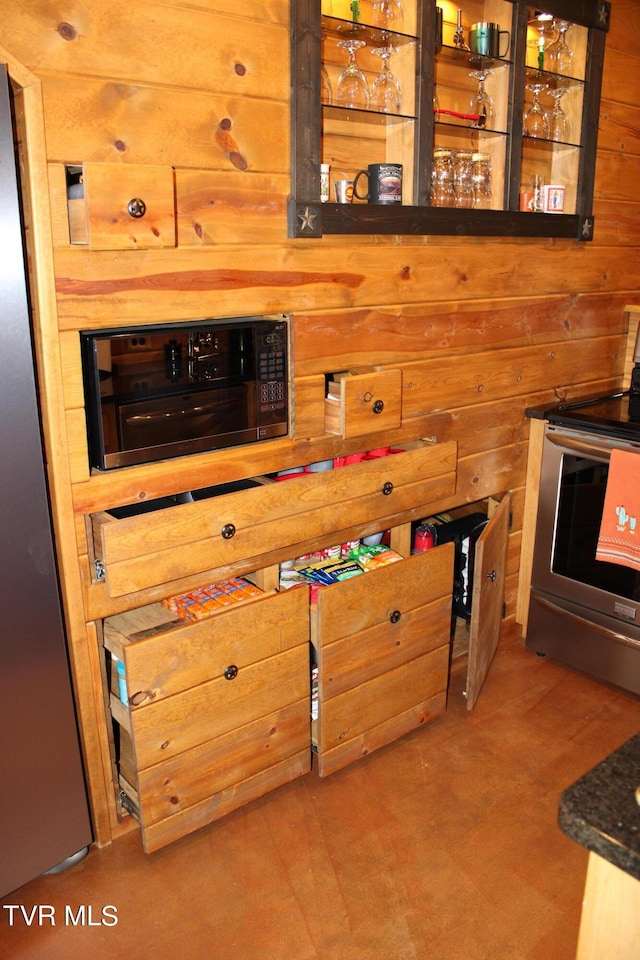 2044 Pigeon Creek Rd, Greeneville, TN 37743 - kitchen with wooden walls and appliances with stainless steel finishes