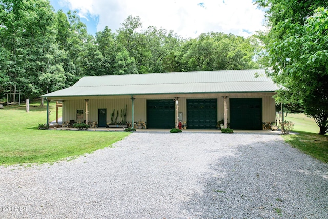 2044 Pigeon Creek Rd, Greeneville, TN 37743 - view of front of house with driveway, metal roof, a garage, and a front lawn