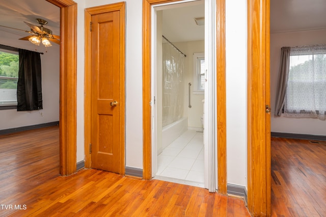 corridor with light tile patterned flooring