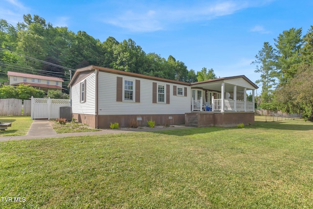 view of front facade with covered porch, crawl space, fence, and a front yard