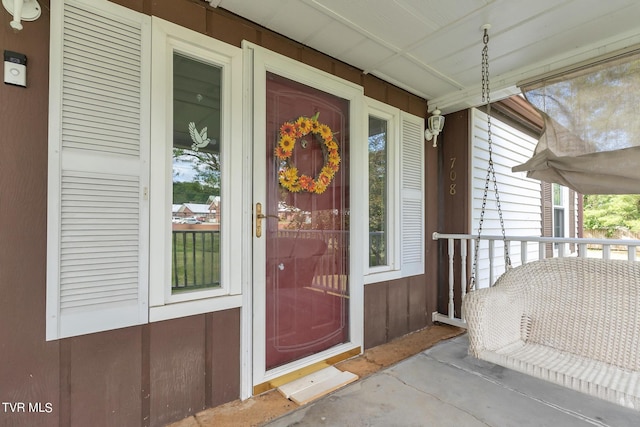 entrance to property featuring covered porch