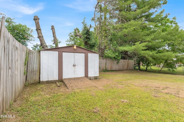 view of shed with a fenced backyard