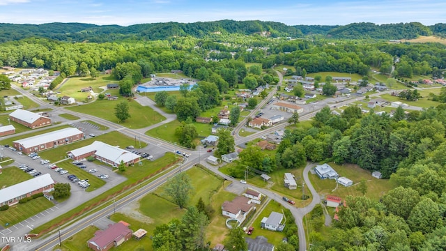 bird's eye view featuring a wooded view