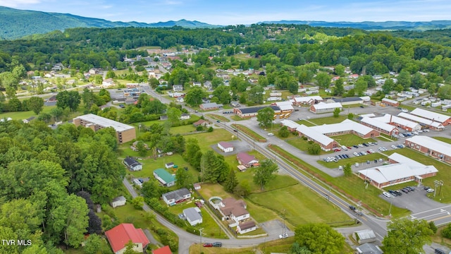 birds eye view of property with a mountain view