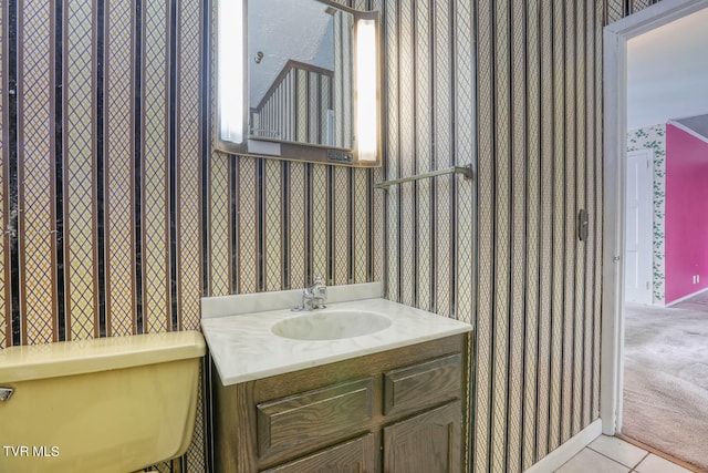 bathroom with tile patterned floors, toilet, and vanity