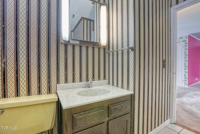 bathroom with vanity, tile patterned floors, and toilet