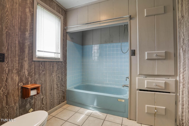 bathroom with tile patterned floors, bathtub / shower combination, and toilet