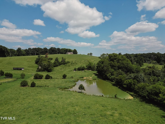 drone / aerial view with a rural view and a water view