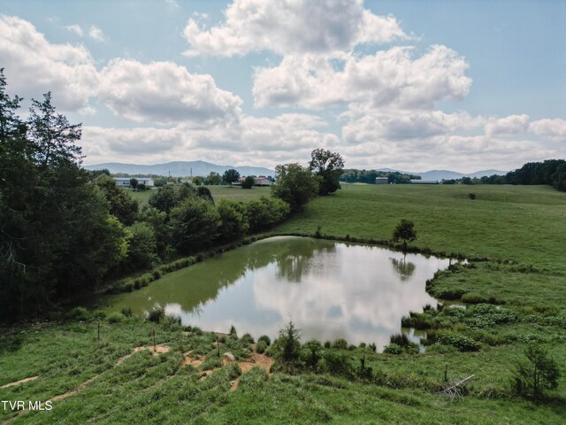 view of water feature with a mountain view and a rural view