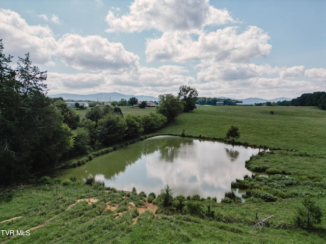 water view with a rural view and a mountain view