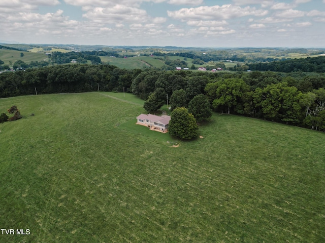 birds eye view of property with a rural view