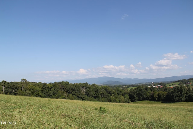 view of mountain feature with a rural view