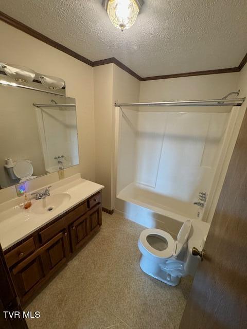 full bathroom featuring toilet, ornamental molding, vanity, a textured ceiling, and  shower combination