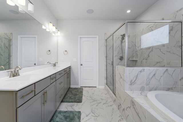 bathroom featuring independent shower and bath, tile patterned flooring, and double sink vanity