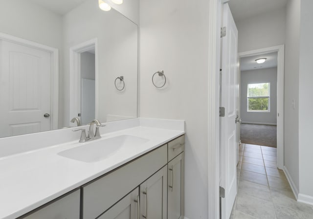 bathroom with vanity and tile patterned flooring