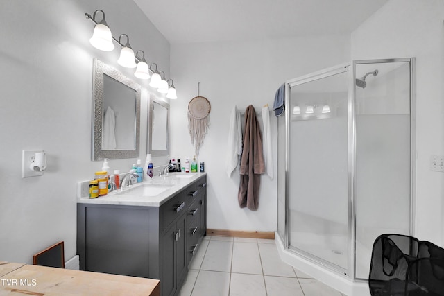 bathroom with tile patterned floors, a shower with shower door, and vanity