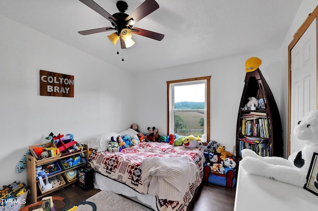 bedroom featuring dark hardwood / wood-style floors and ceiling fan