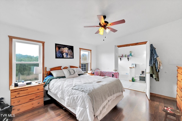 bedroom with dark wood-type flooring, ceiling fan, and multiple windows