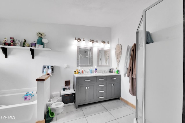 bathroom featuring vanity, a bathing tub, and tile patterned flooring