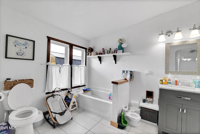 bathroom featuring tile patterned floors, a tub to relax in, toilet, and vanity