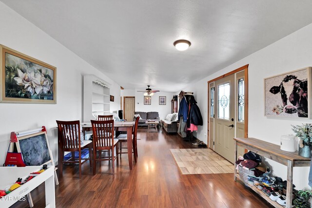 entryway featuring ceiling fan and dark hardwood / wood-style floors