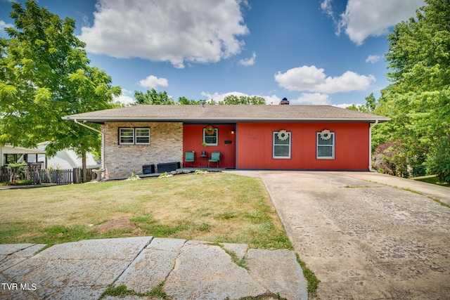 ranch-style home with a front lawn