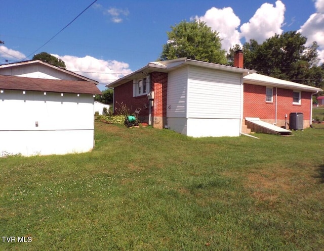 view of property exterior with a lawn