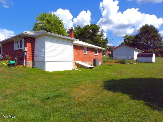 view of side of home with a lawn