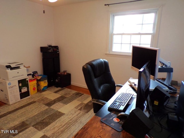 home office with wood-type flooring