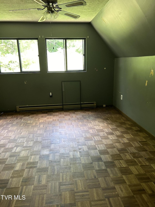 bonus room with ceiling fan, a baseboard radiator, and lofted ceiling