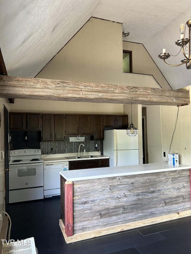 kitchen with sink, decorative light fixtures, lofted ceiling with beams, a textured ceiling, and white appliances