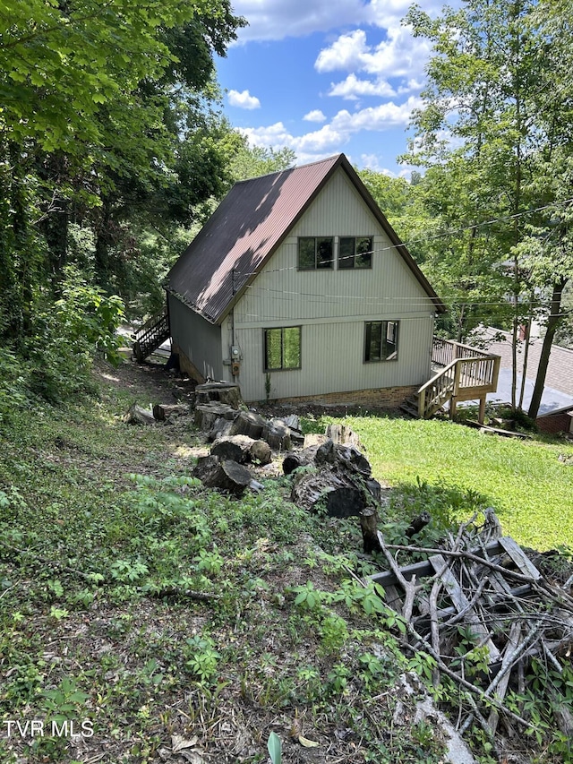 view of home's exterior with a deck