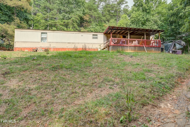 view of yard with a wooden deck