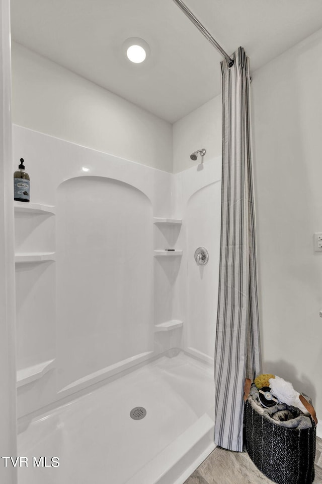 bathroom featuring a shower with curtain